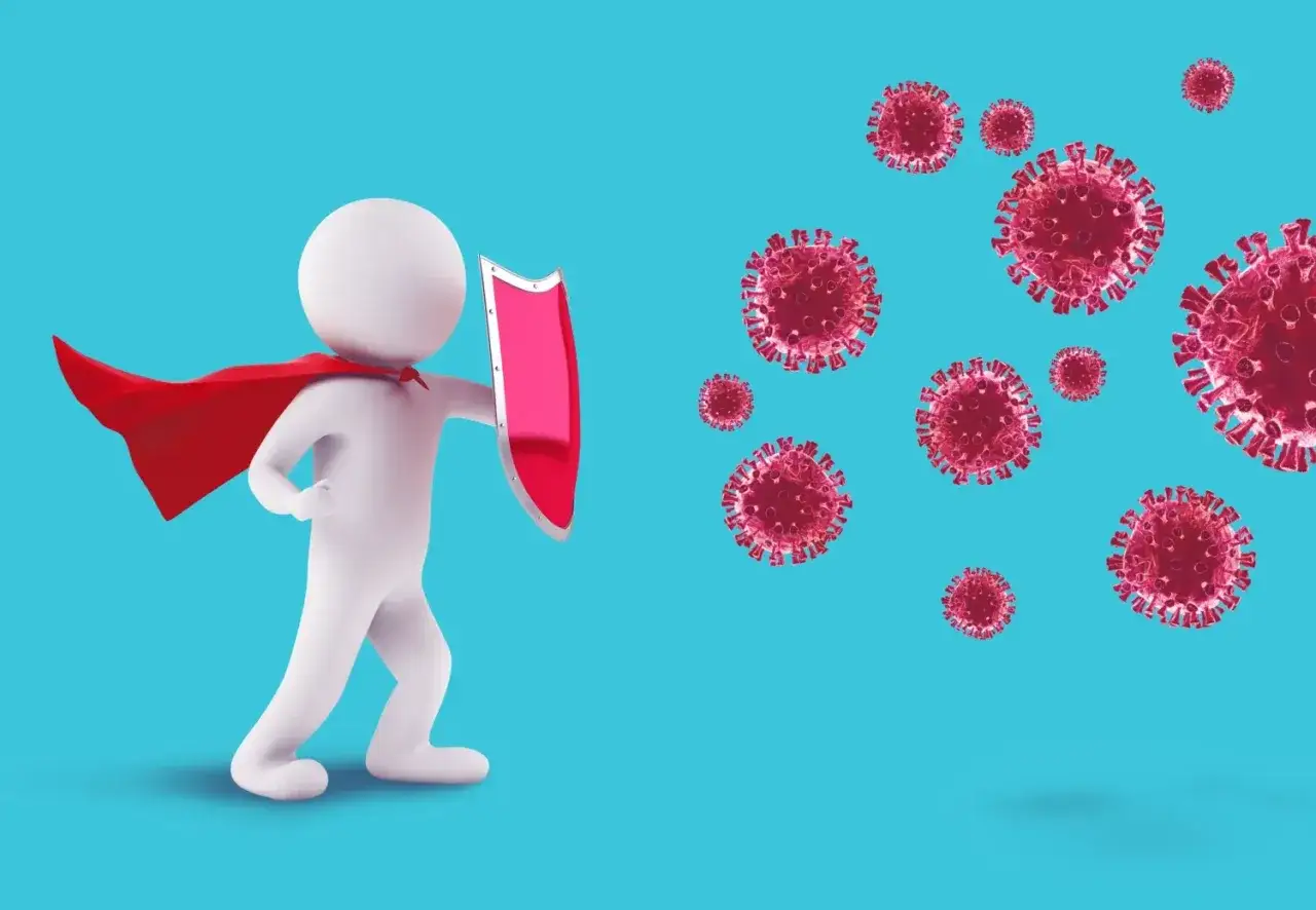 En vit figur med r&ouml;d mantel och sk&ouml;ld st&aring;r emot virus. Kroppen liknar en hj&auml;lte som skyddar mot virus, som om det vore nk-celler som f&ouml;rsvarar kroppen.