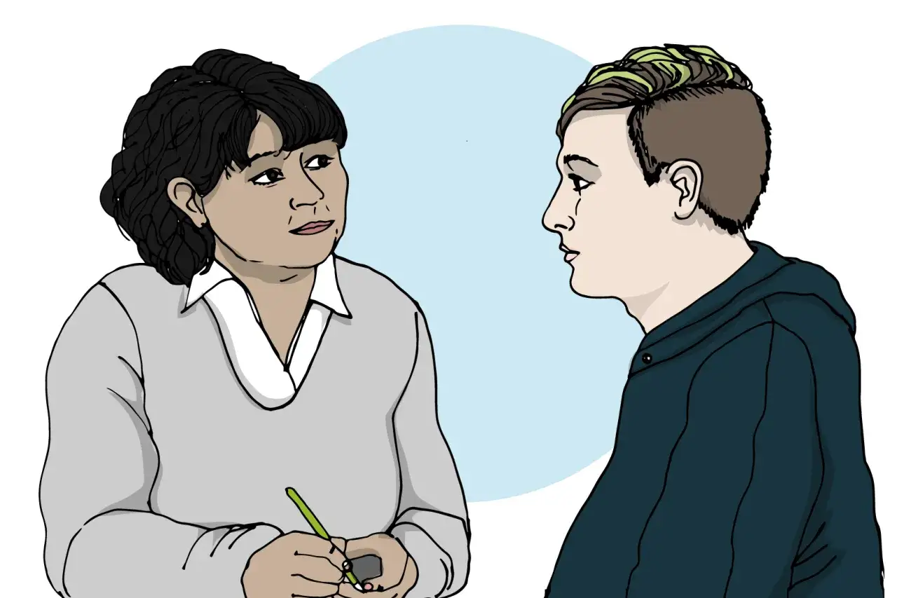 En terapeut lyssnar på en ung person som visar tecken på anorexia.